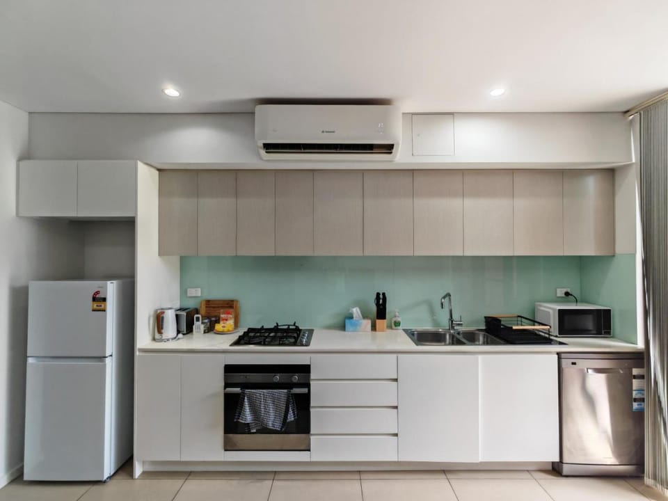 Kitchen or kitchenette, dishwasher, oven, stove