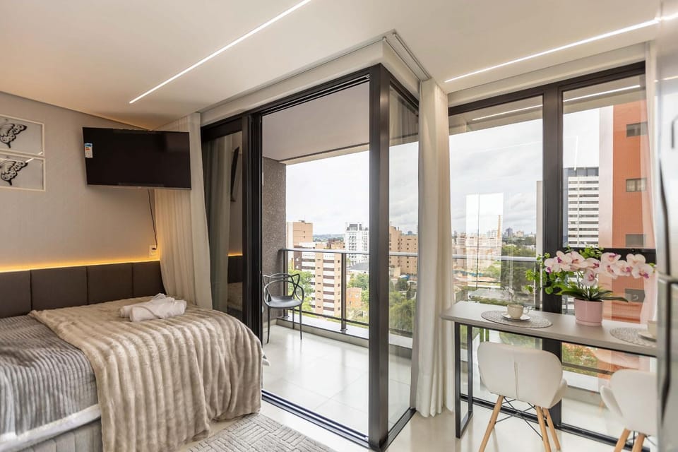 Varanda panorâmica | Suíte Comfort Batel Apartment in Curitiba