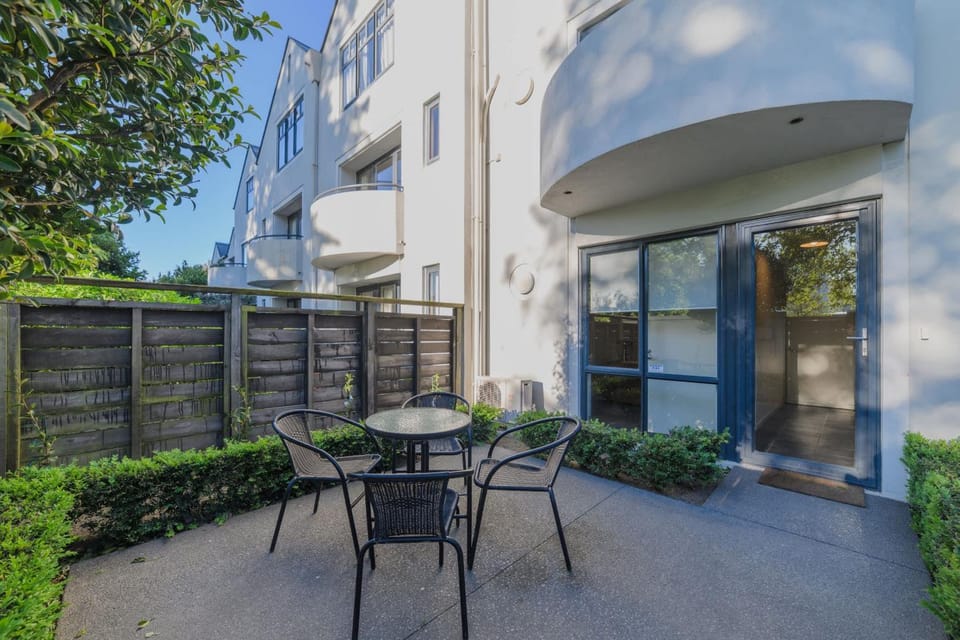 Elegant 3-Storey Townhouse with Garage Parking by Latimer Sq House in Christchurch