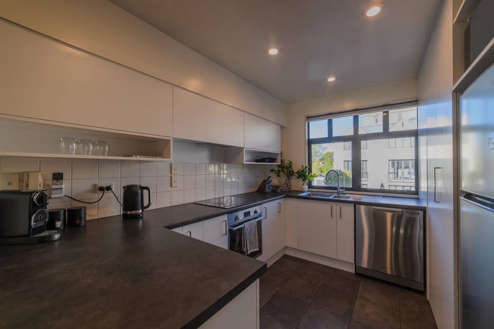 Elegant 3-Storey Townhouse with Garage Parking by Latimer Sq House in Christchurch