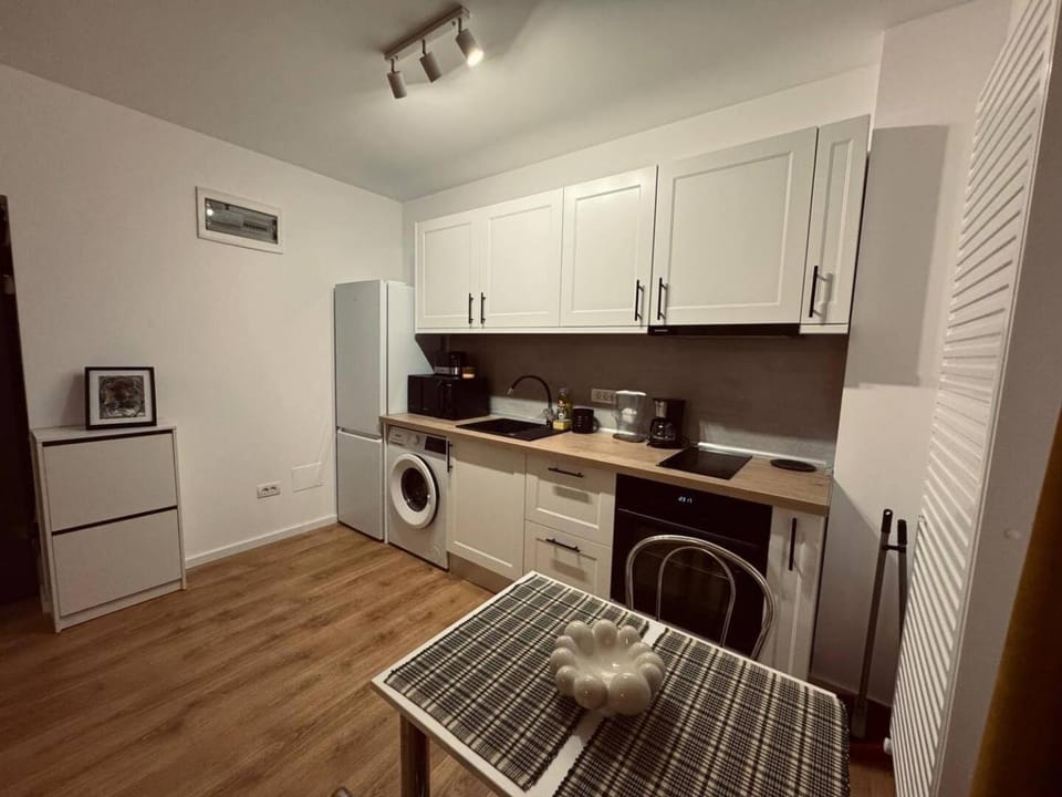 Kitchen or kitchenette, washing machine