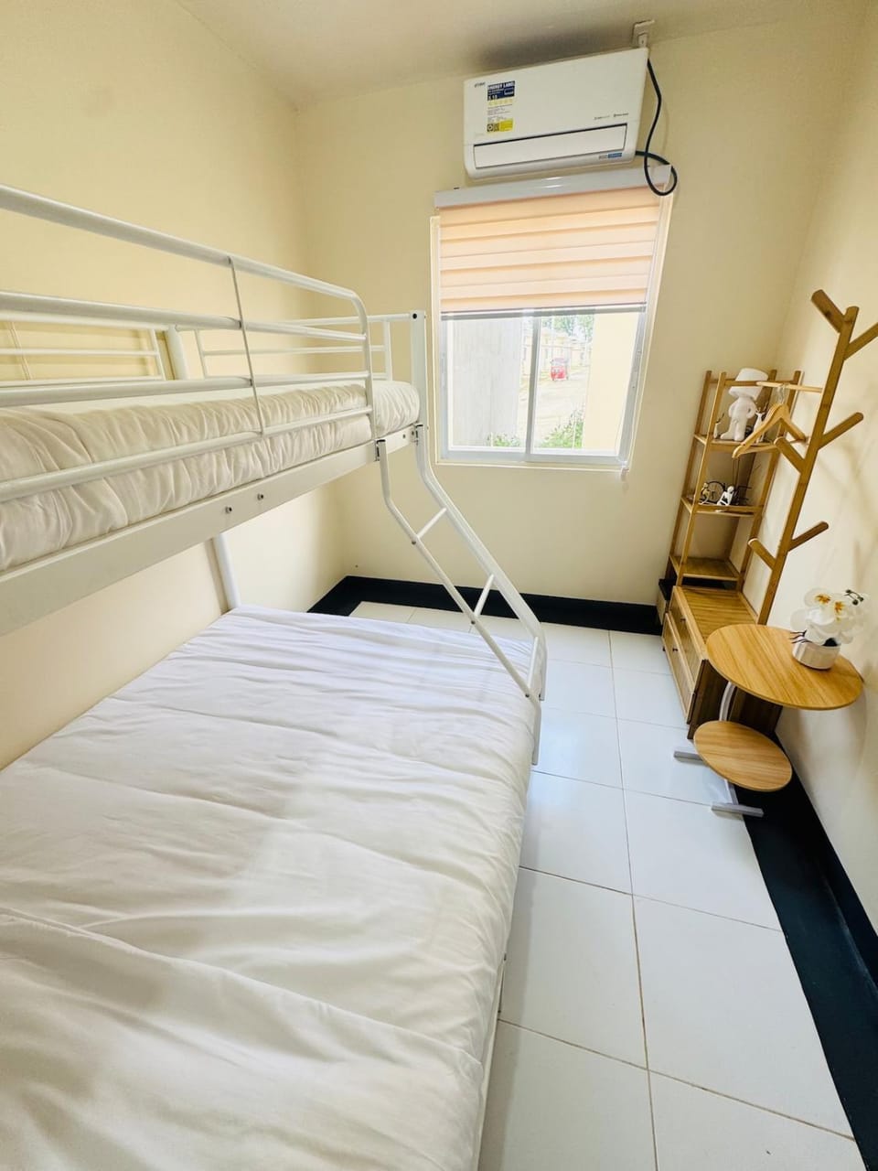 Photo of the whole room, bunk bed, air conditioner