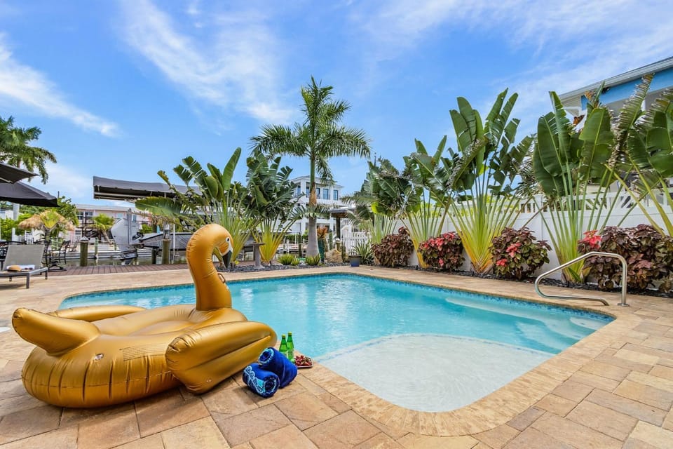 Luxury Waterfront Getaway with Heated Pool, Dock & Outdoor Kitchen - The Primo House House in Estero Island