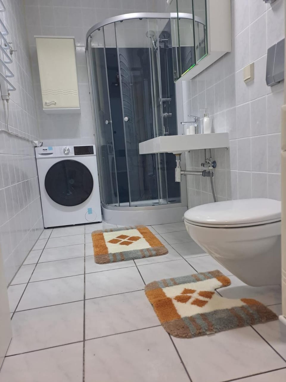 Shower, Toilet, Bathroom, towels, washing machine, dryer