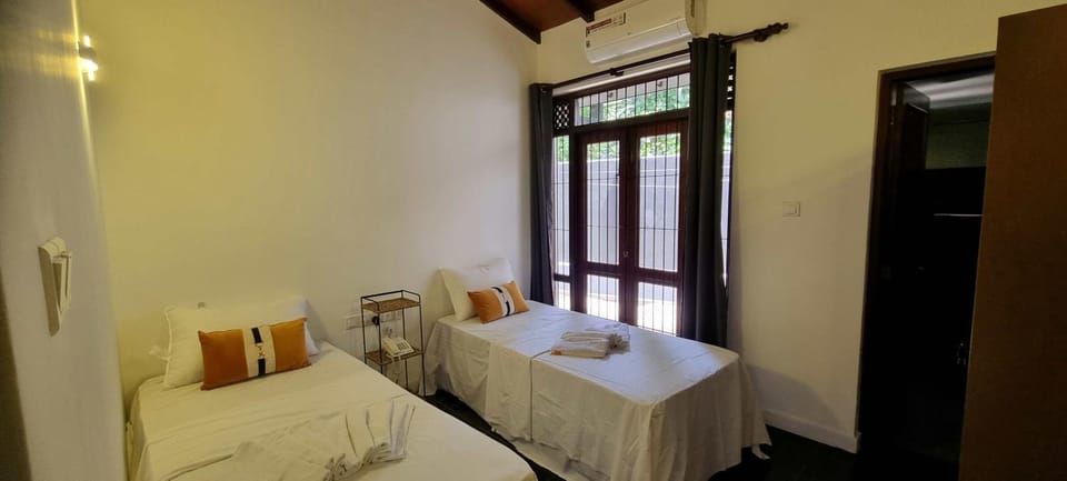 Photo of the whole room, Bedroom, towels, air conditioner