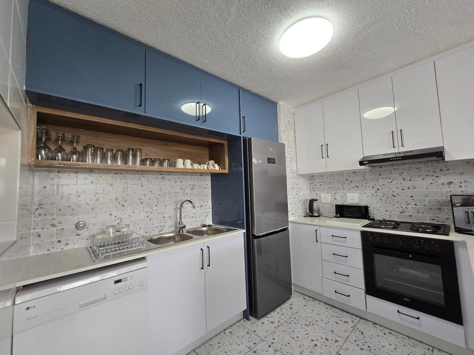 Kitchen or kitchenette, oven, stove, toaster
