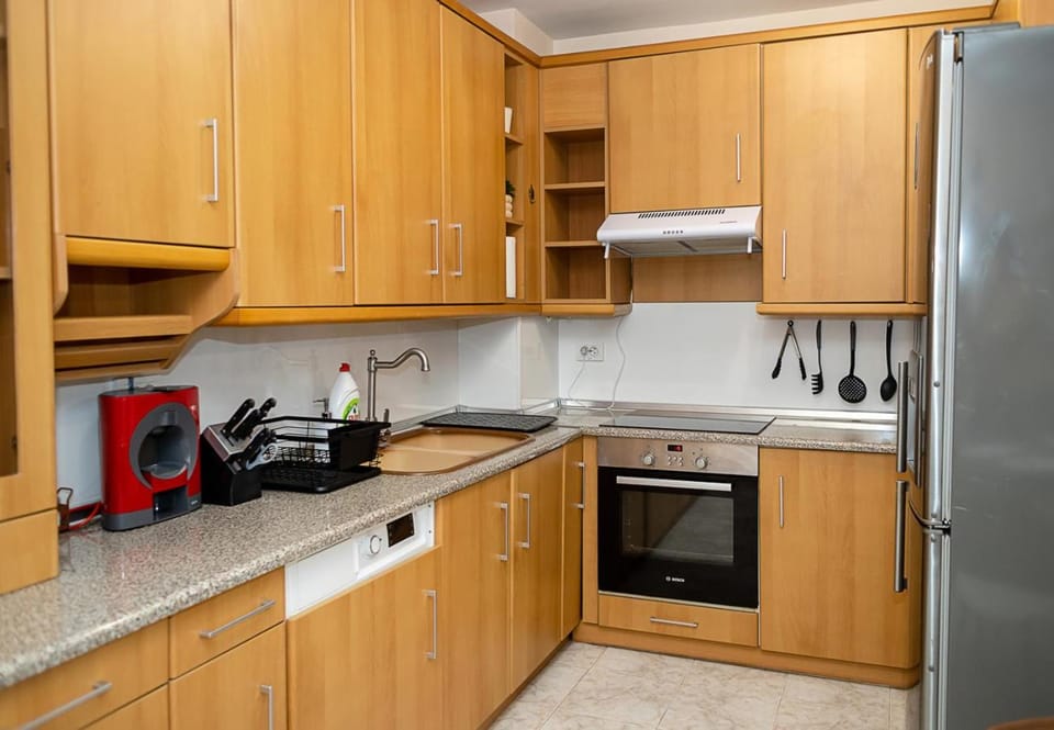 Kitchen or kitchenette, dishwasher, oven, stove