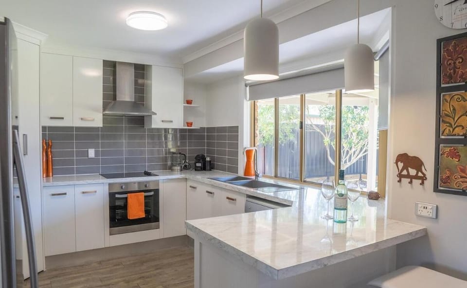 Kitchen or kitchenette, dishwasher, oven, stove