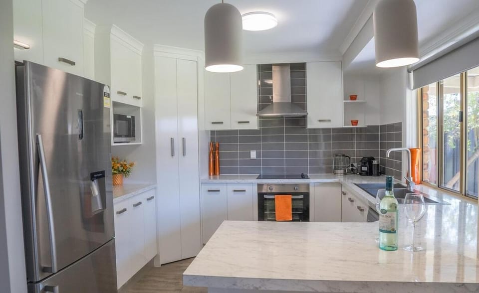 Kitchen or kitchenette, dishwasher, oven, stove
