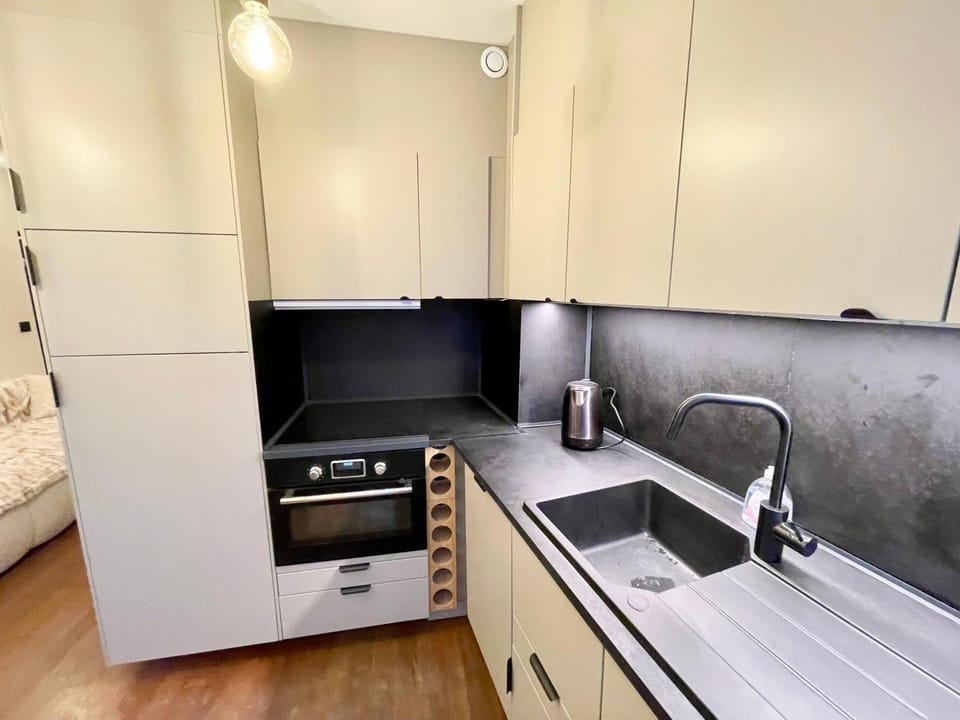 Kitchen or kitchenette, dishwasher, oven, stove