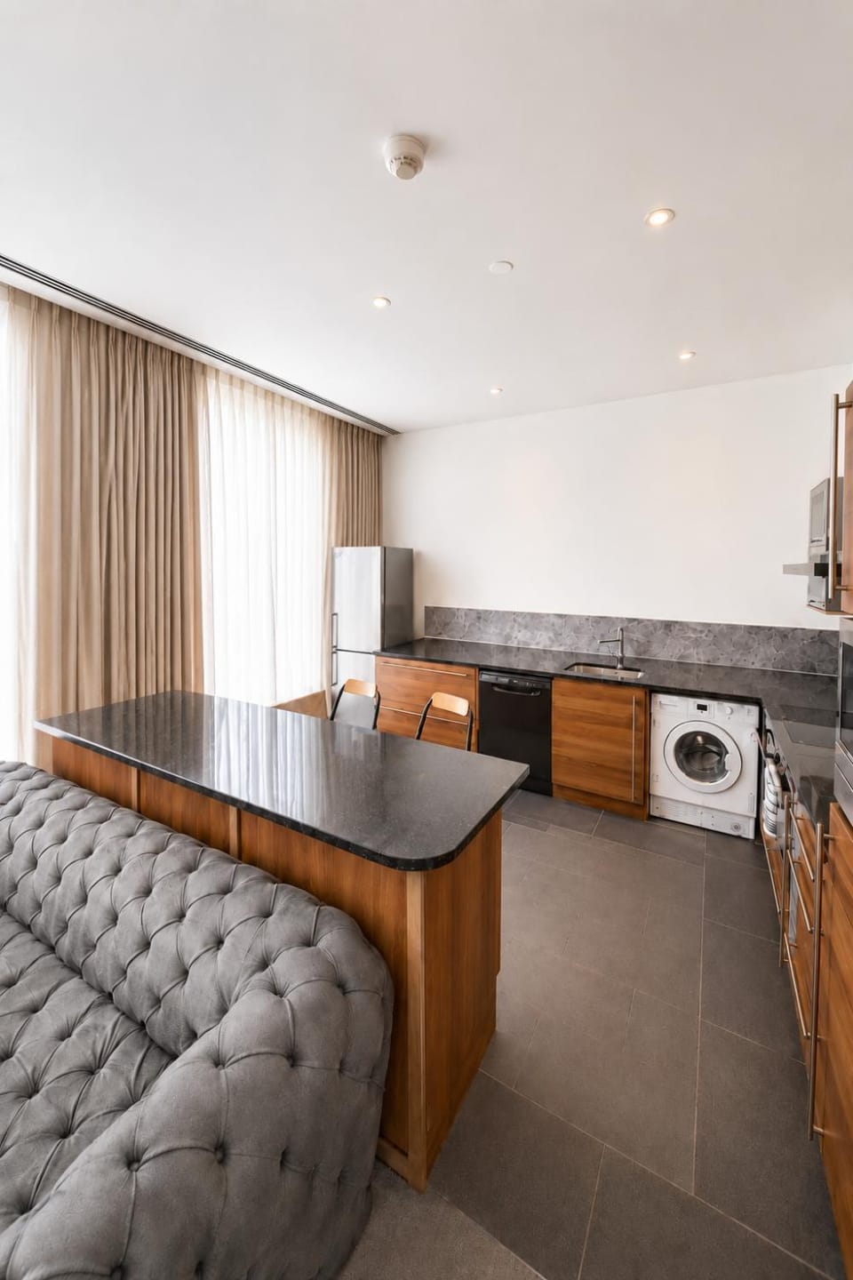 Kitchen or kitchenette, Living room, Seating area, dishwasher, oven, stove, washing machine