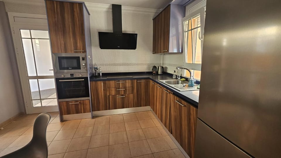 Kitchen or kitchenette, dishwasher, oven, stove