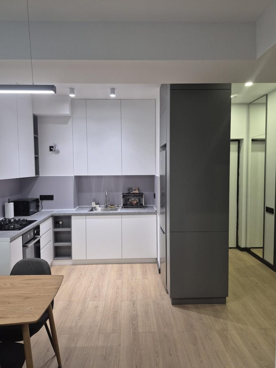 Kitchen or kitchenette, microwave, oven, stove