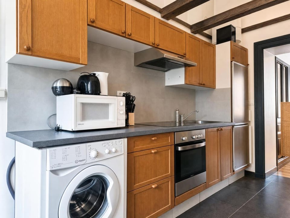 Kitchen or kitchenette, oven, stove, toaster, washing machine