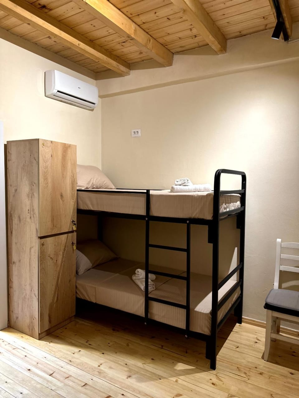 Bed, bunk bed, locker, towels, air conditioner