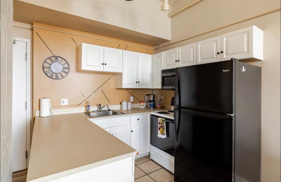 Kitchen or kitchenette, dishwasher, oven, stove