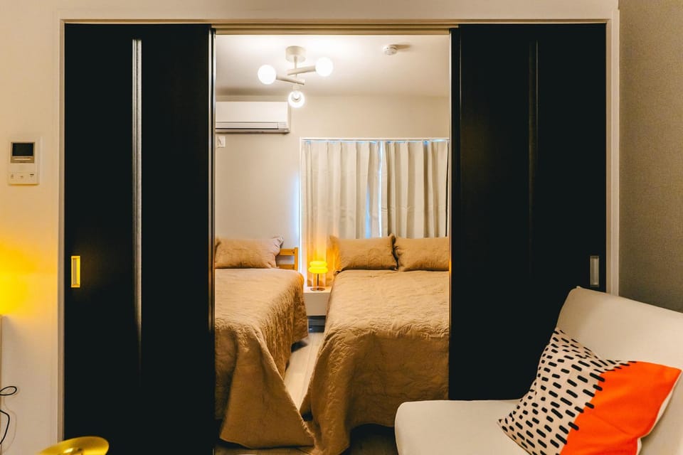 Bed, Living room, Seating area, Bedroom, air conditioner