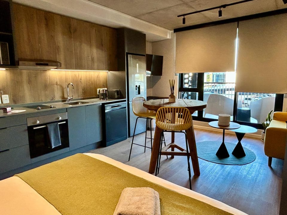 Kitchen or kitchenette, Living room, Seating area, Dining area, dishwasher, oven, stove, toaster