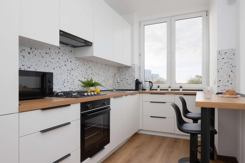 Kitchen or kitchenette, dishwasher, oven, stove
