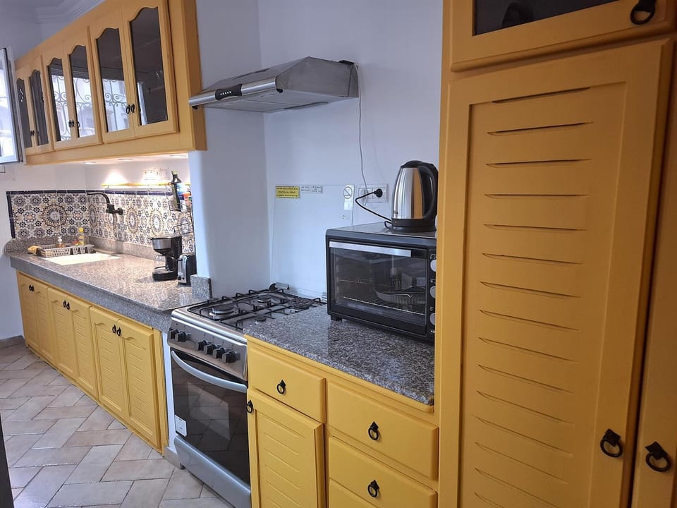 Kitchen or kitchenette, stove, toaster