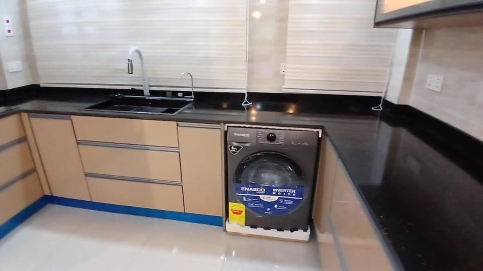 Kitchen or kitchenette, washing machine