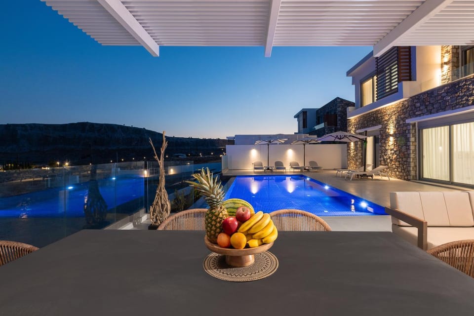 Property building, Night, Natural landscape, Balcony/Terrace, Dining area, Mountain view, Pool view, Swimming pool, sunbed