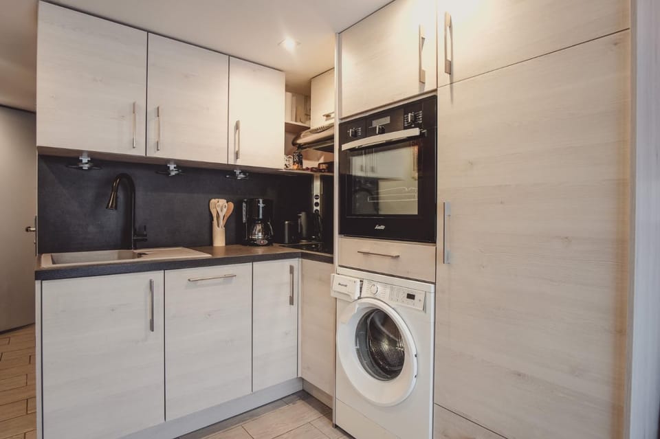 Kitchen or kitchenette, dishwasher, oven, stove, washing machine