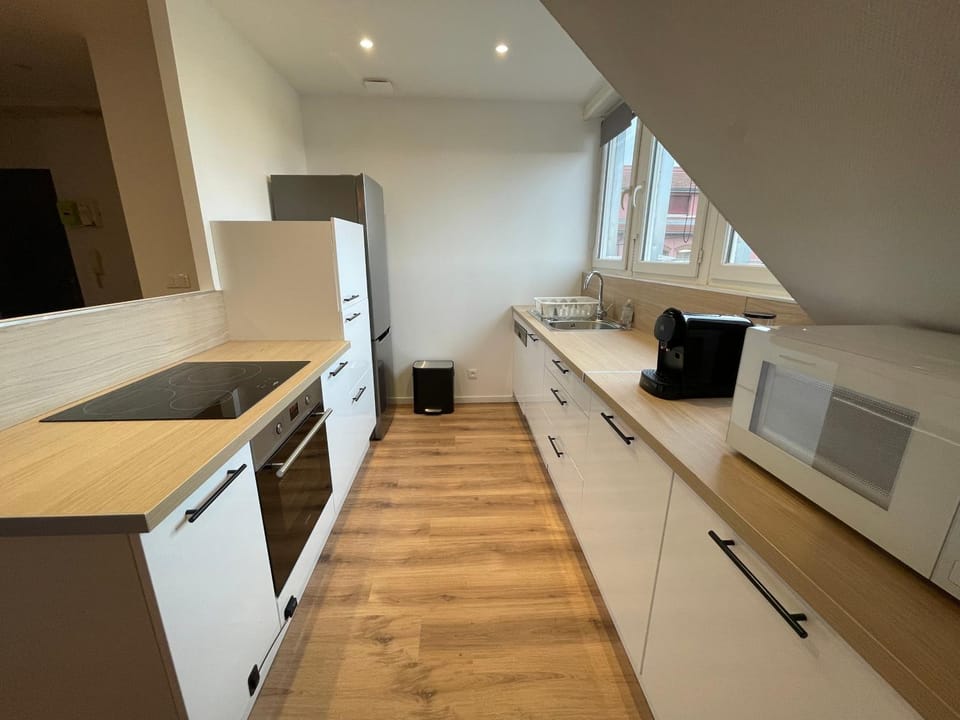 Kitchen or kitchenette, dishwasher, oven, stove, toaster