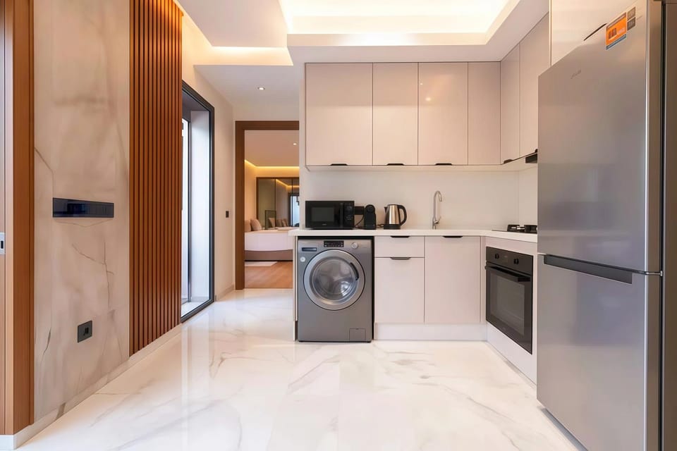 Kitchen or kitchenette, oven, stove, washing machine