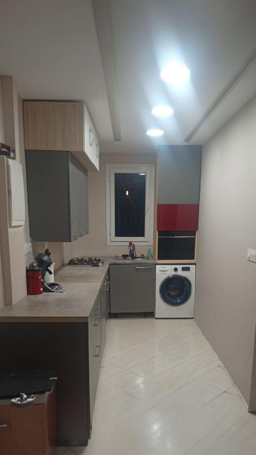 Kitchen or kitchenette, dishwasher, oven, stove, washing machine