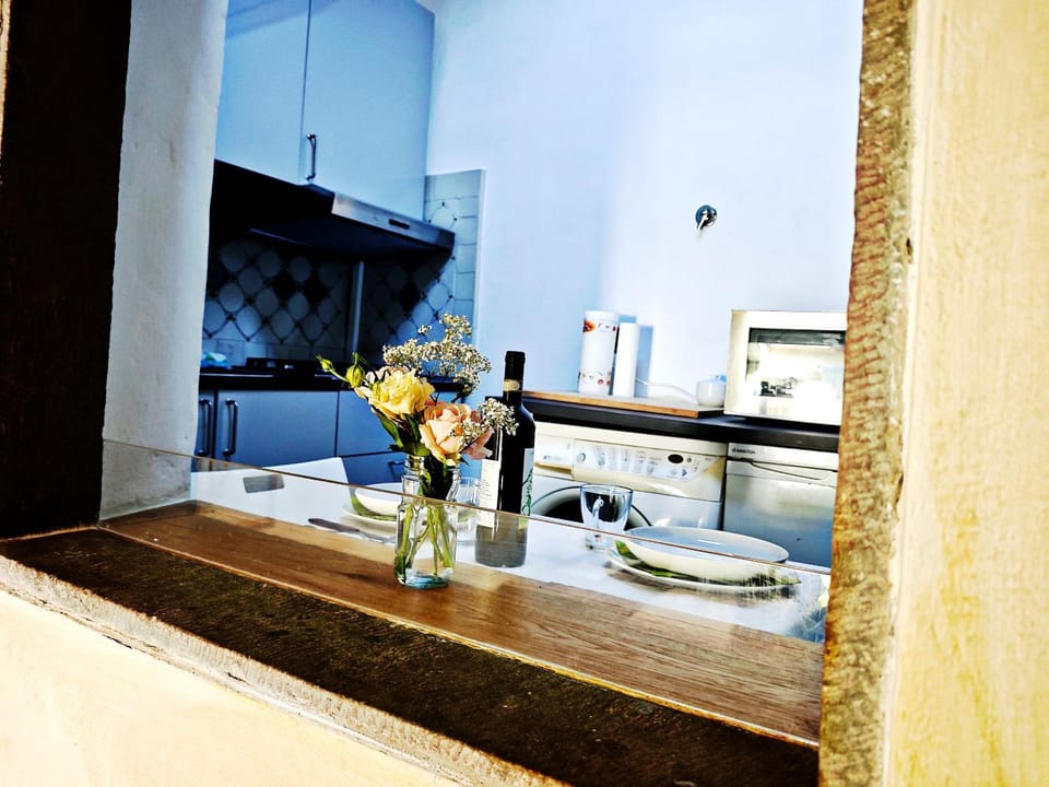 Kitchen or kitchenette, washing machine