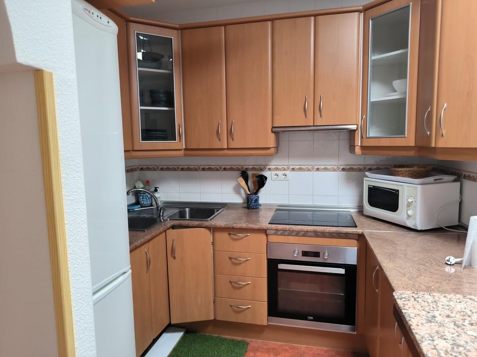 Kitchen or kitchenette, oven, stove, toaster