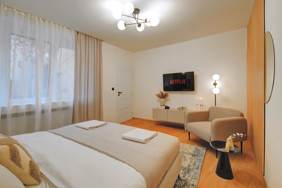 Bed, Living room, Seating area, Bedroom
