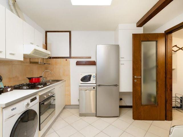 Kitchen or kitchenette, dishwasher, oven, stove, washing machine
