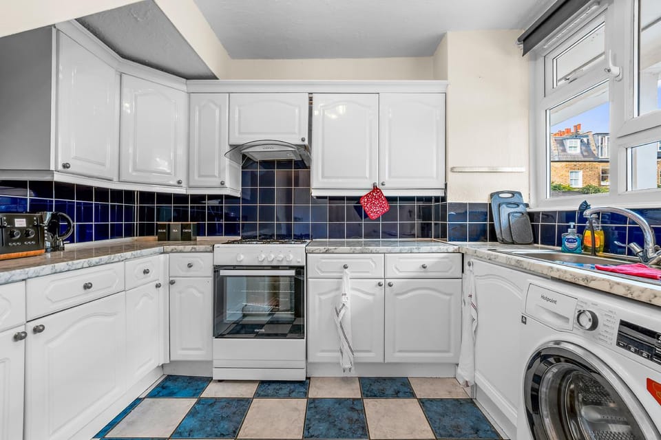 Kitchen or kitchenette, dishwasher, oven, stove, washing machine, dryer