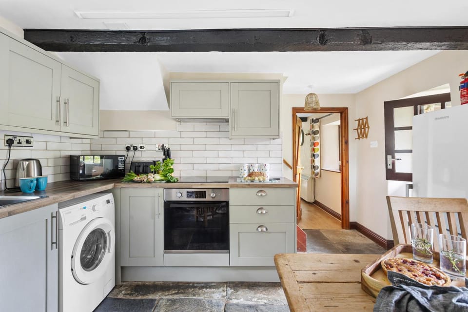 Kitchen or kitchenette, dishwasher, oven, stove, toaster, washing machine, dryer