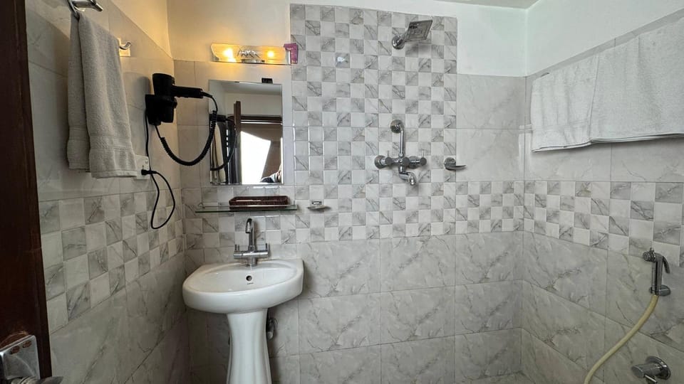 Shower, Bathroom, hair dryier, towels
