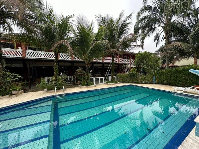 Property building, Day, Pool view, Swimming pool, sunbed