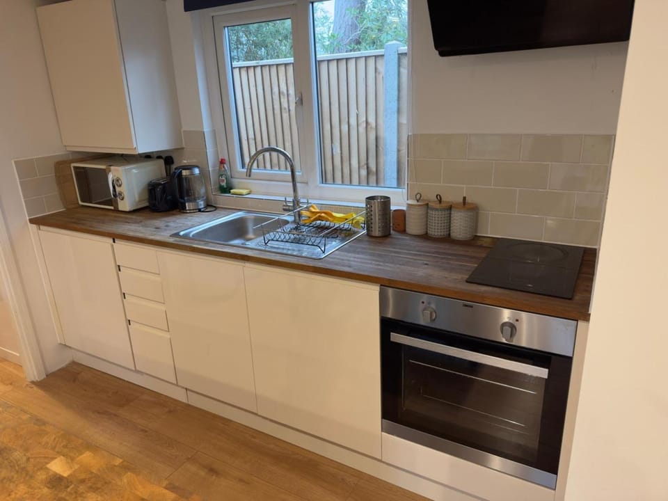 Kitchen or kitchenette, microwave, oven, stove, toaster