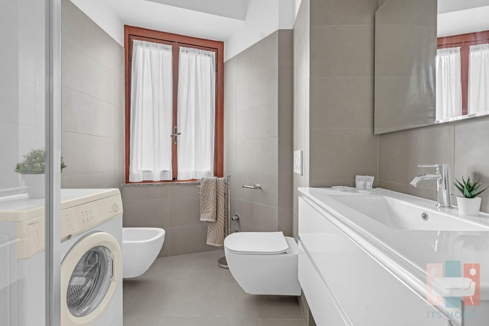 Toilet, Bathroom, bidet, towels, washing machine