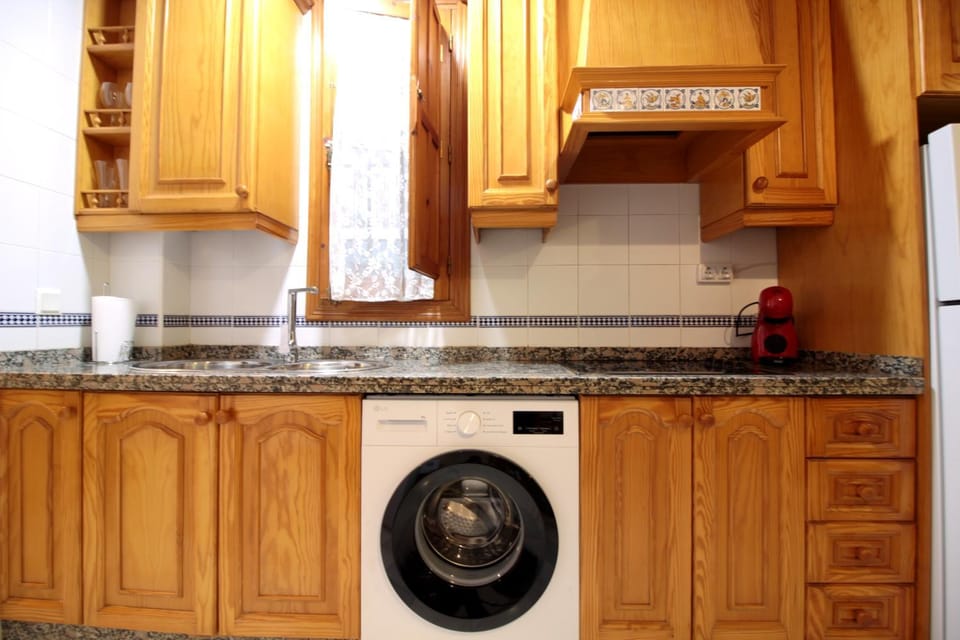 Kitchen or kitchenette, washing machine