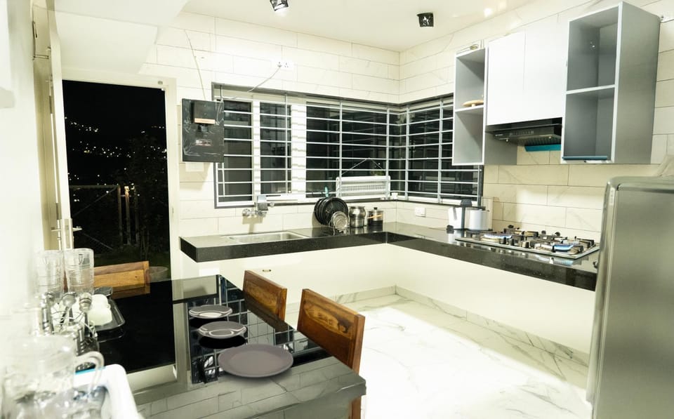 Kitchen or kitchenette, dishwasher, oven, stove