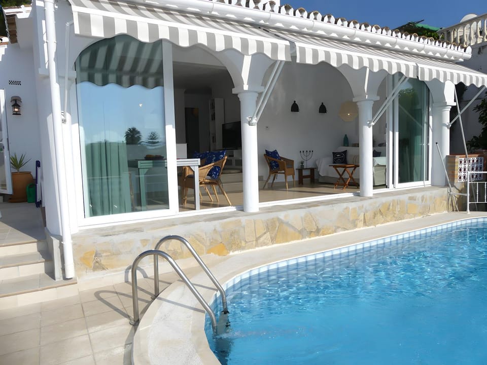 Property building, Living room, Swimming pool
