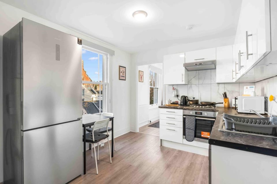 Kitchen or kitchenette, dishwasher, microwave, oven, stove, toaster