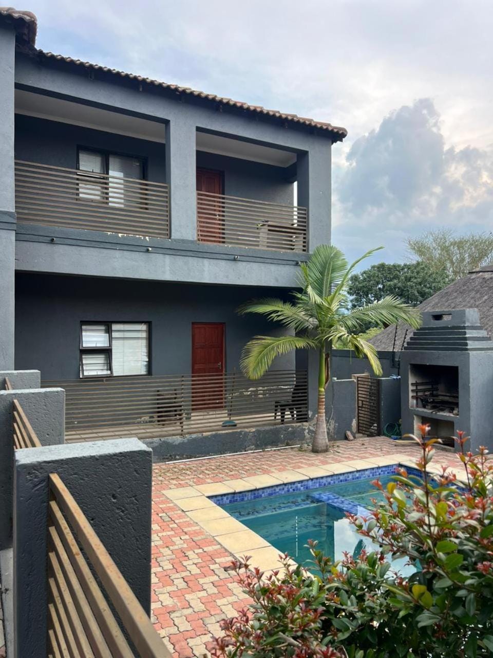Property building, Day, Pool view, Swimming pool, sunbed