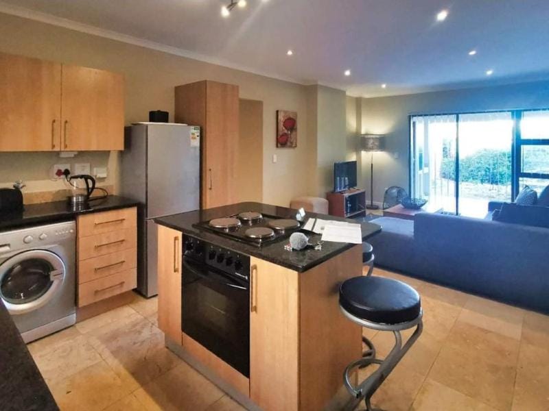 Kitchen or kitchenette, Living room, oven, stove, washing machine, dryer