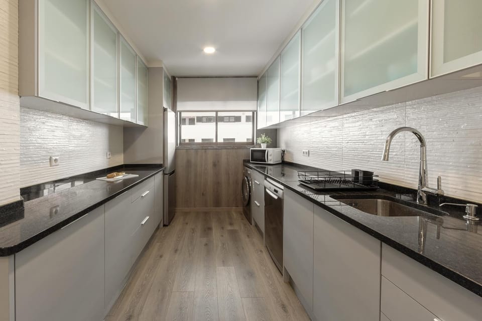 Kitchen or kitchenette, dishwasher, microwave, stove, washing machine, kitchen