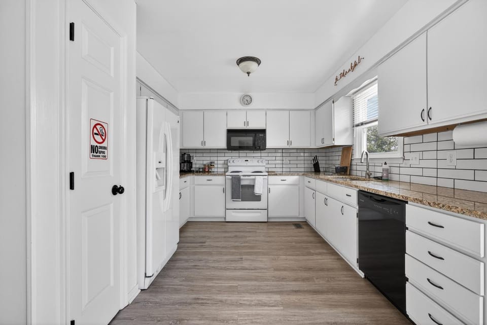 Kitchen or kitchenette, dishwasher, oven, stove