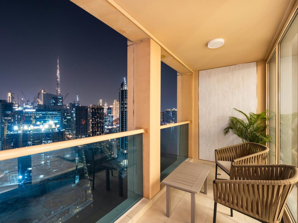 Patio, Night, View (from property/room), Balcony/Terrace, Living room, Seating area, City view, Pool view, Swimming pool