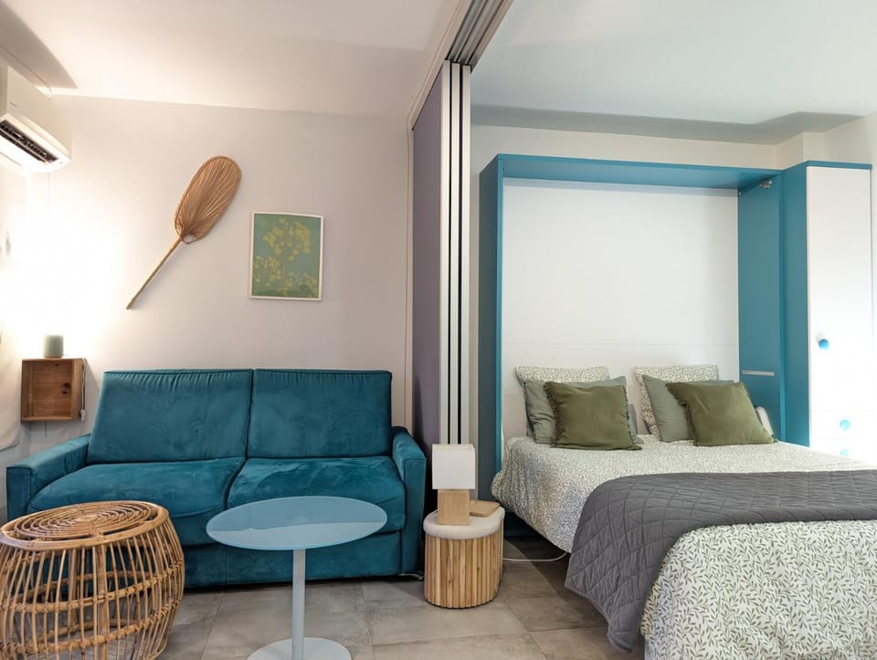 Bed, Living room, Seating area, Bedroom